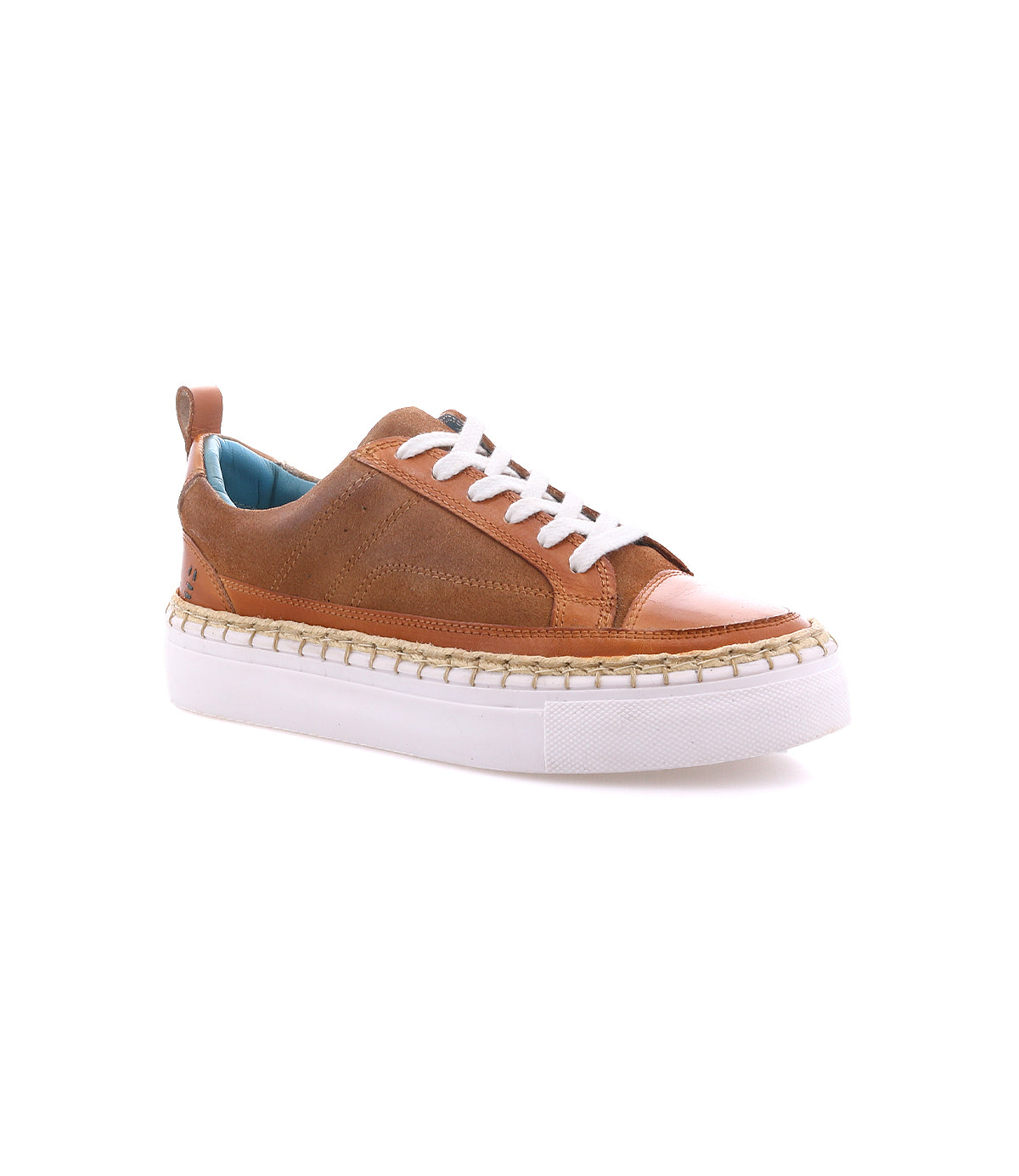 The Roan Void sneaker is crafted from brown leather with mixed textures, featuring white laces, a light blue inner lining, cushioned interior, and a thick white rubber sole with a jute-wrapped edge, displayed on a white background.