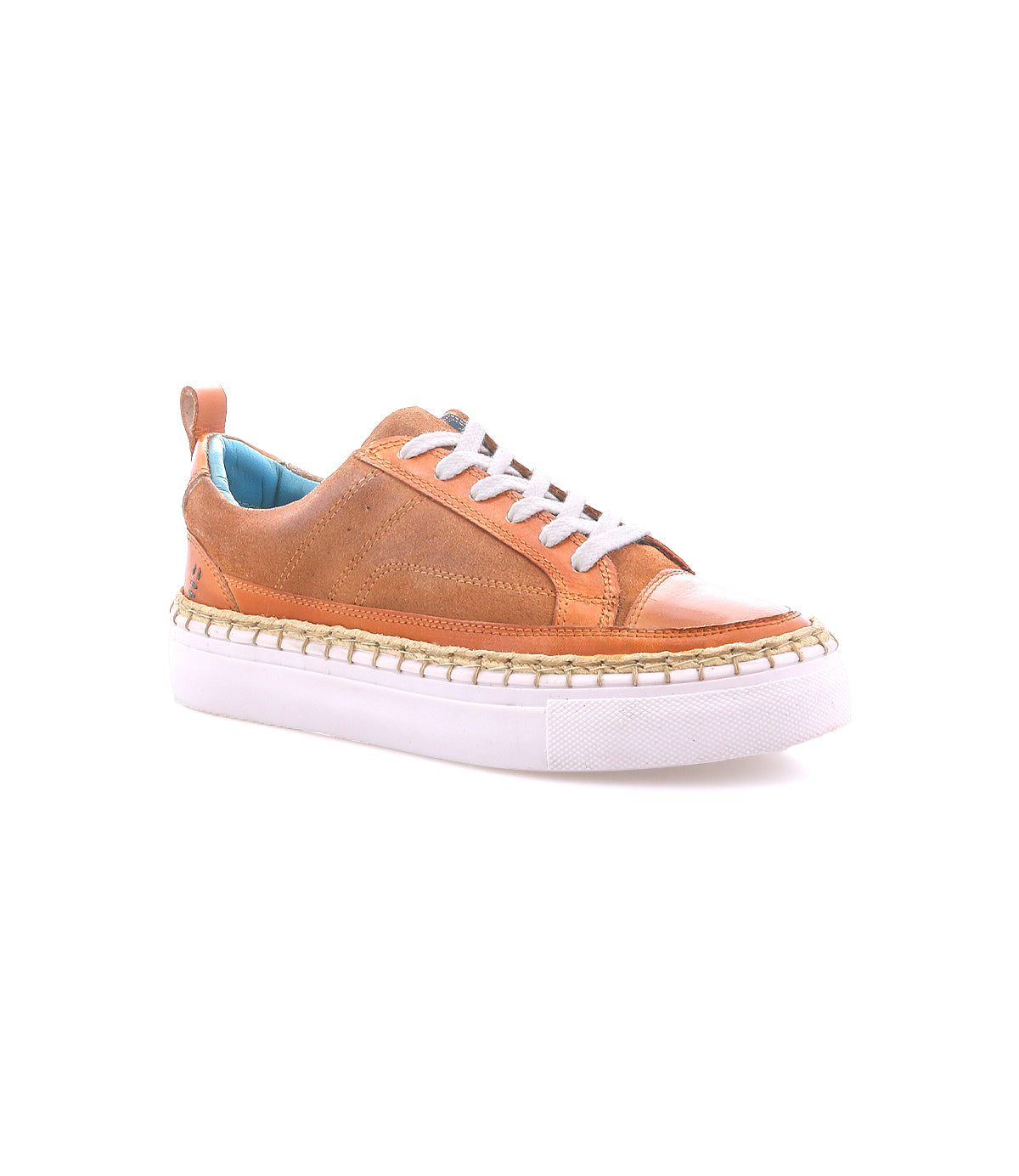 The Roan Void sneaker features mixed brown leather textures, white laces, a white platform sole, and a blue inner lining, shown against a plain white background.