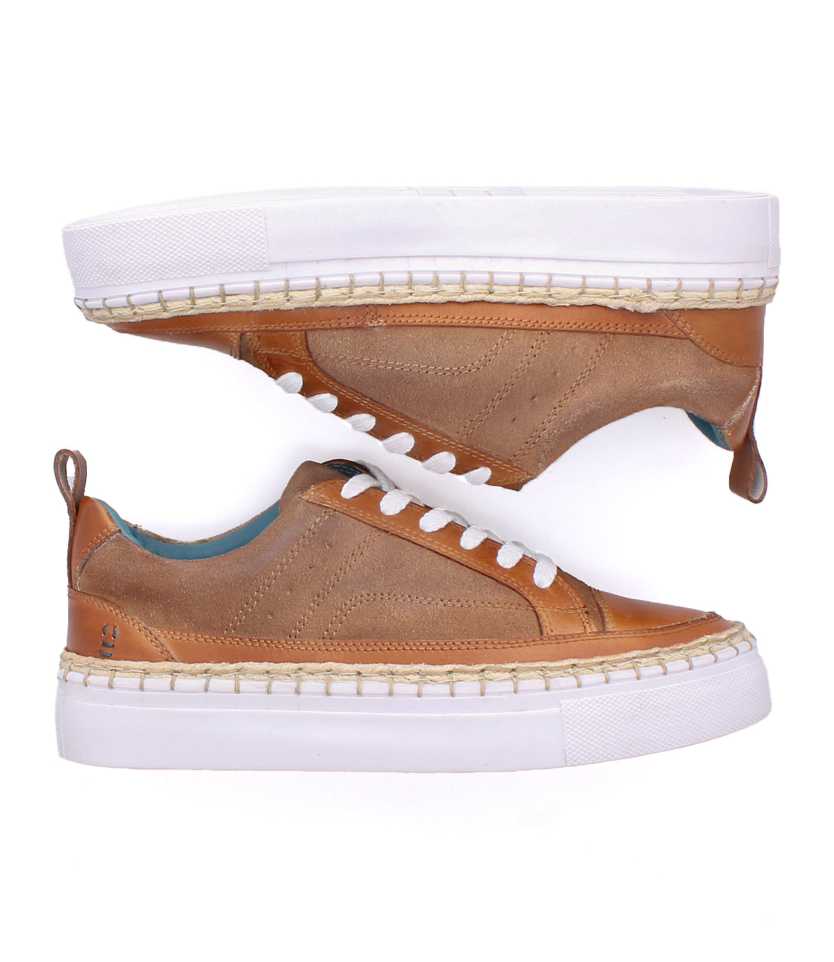
                  
                    The Roan Void sneakers are brown low-tops with mixed textures, white laces, and thick white soles, displayed from side and top views against a white background.
                  
                