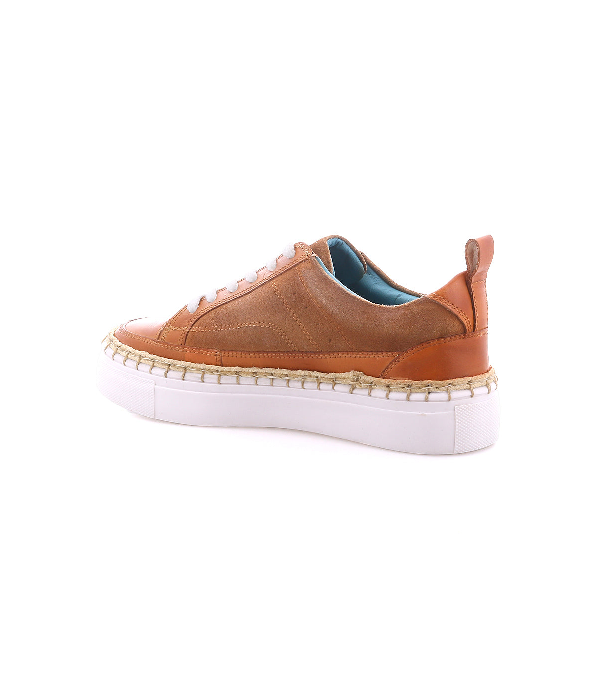 
                  
                    The Roan Void sneakers feature brown leather with mixed textures, a white chunky sole, tan stitching, teal lining, cushioned interior, and a heel pull tab—all displayed on a white background.
                  
                