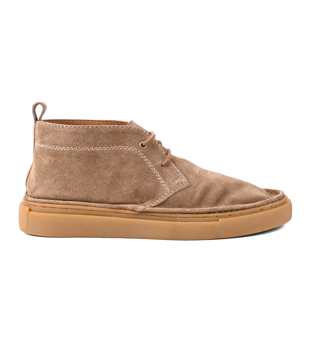 
                  
                    The Roan Volunteer is a tan suede chukka boot featuring a sneaker-style gum rubber sole, lace-up front, visible stitching, and a pull tab at the heel, pictured in side profile against a white background.
                  
                