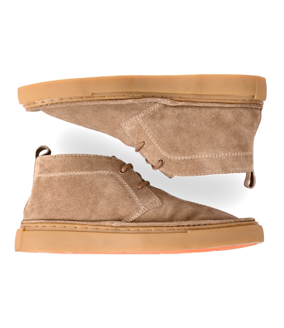 
                  
                    A pair of Roan Volunteer beige suede chukka desert boots featuring tan rubber soles and a convenient pull tab at the heel, displayed in side and top views against a white background.
                  
                