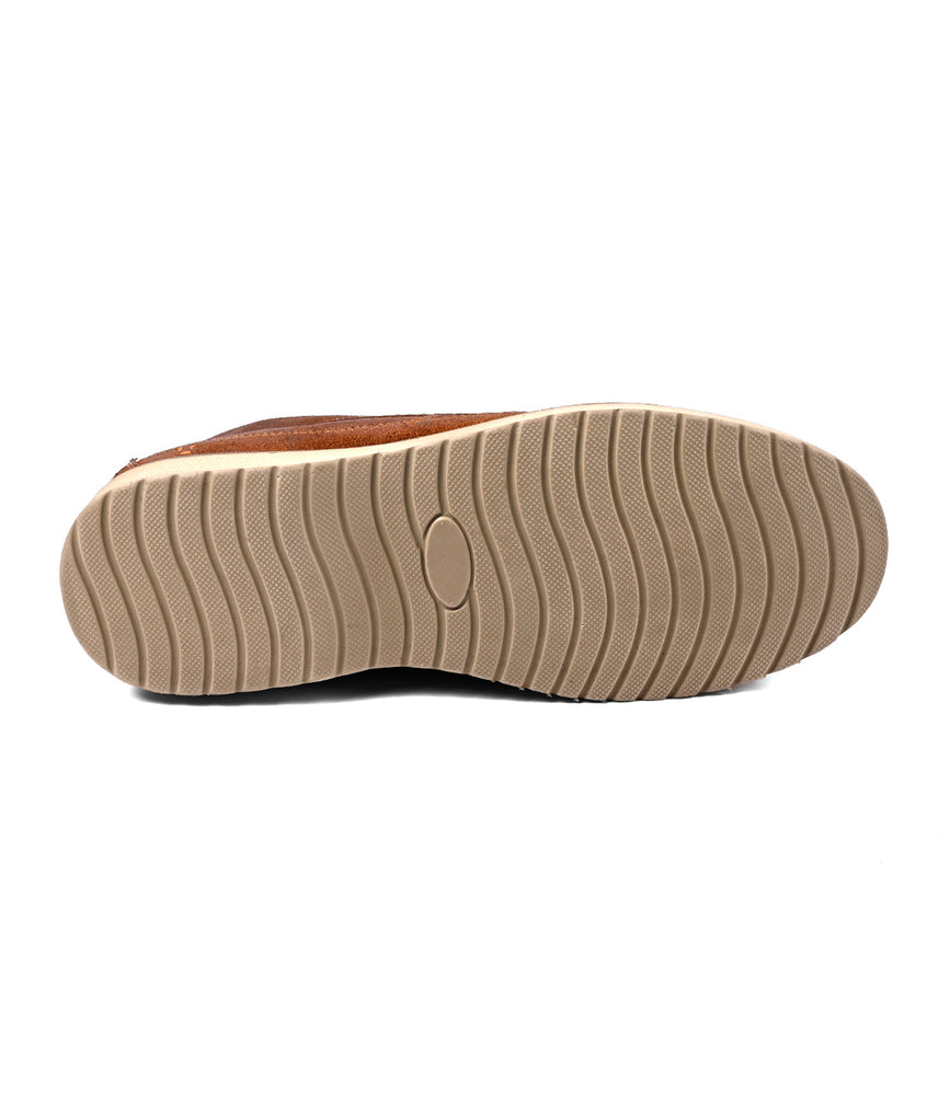
                  
                    The image shows the bottom view of the Roan Warden chukka boot in brown suede, featuring a beige rubber sole with a wavy pattern.
                  
                