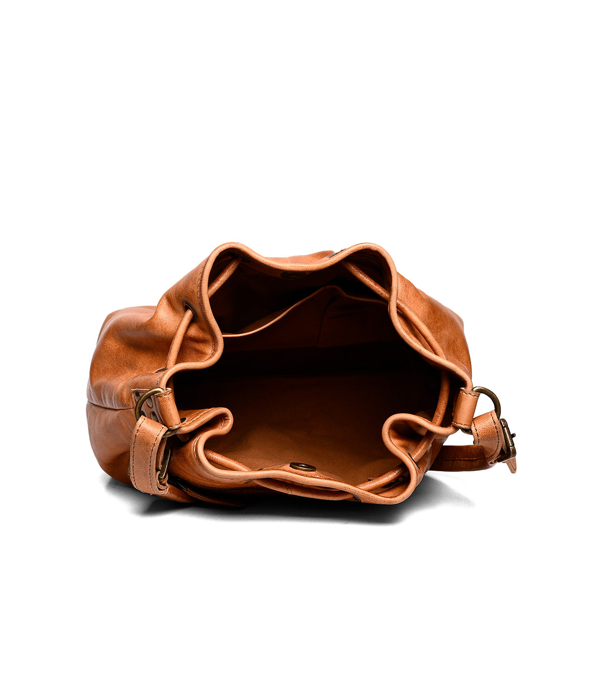 
                  
                    The Roan Zone bucket bag in tan cow suede leather is shown from the top, revealing a spacious main compartment and a small inner pocket against a white background.
                  
                
