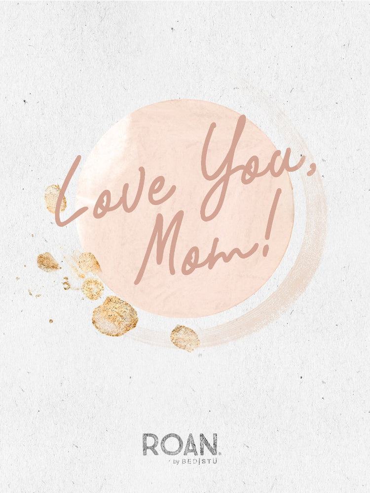 Graphic image with a pink circle and gold smudges, featuring the handwritten text "Love You Mom" on a textured white background, available as an eGift card online from Roan.